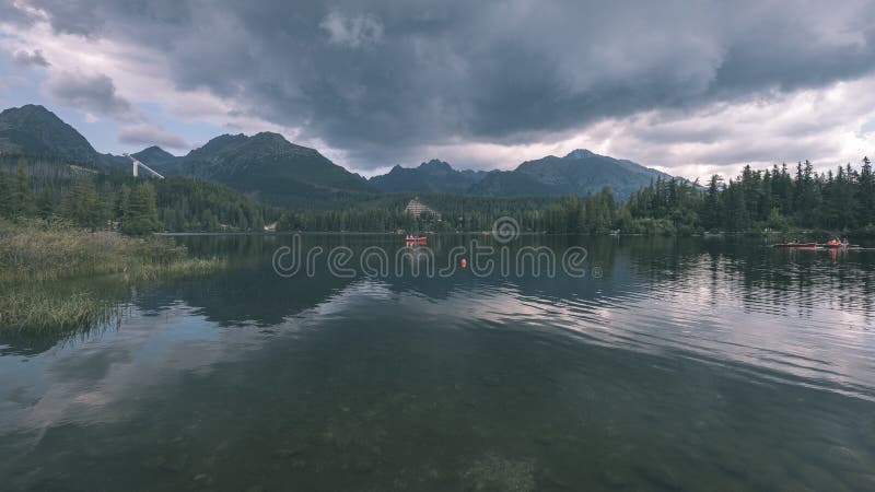 Autumn nature reflection in lake of Strbske Pleso in Slovakia -