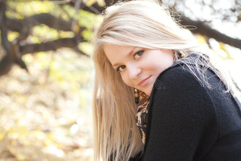 Autumn portrait of blonde girl