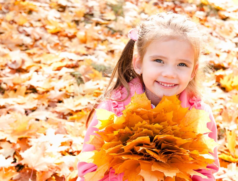 Autumn Portrait of Cute Smiling Little Girl with Maple Leaves Stock ...