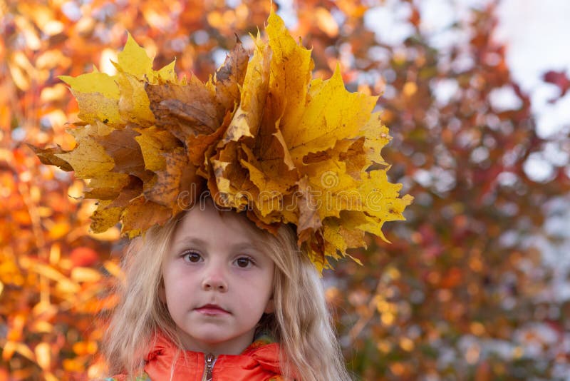 Autumn. Portrait of a Girl with a Wreath of Yellow Fallen Maple Leaves ...