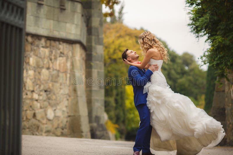 Autumn portrait of happy wedding couple.