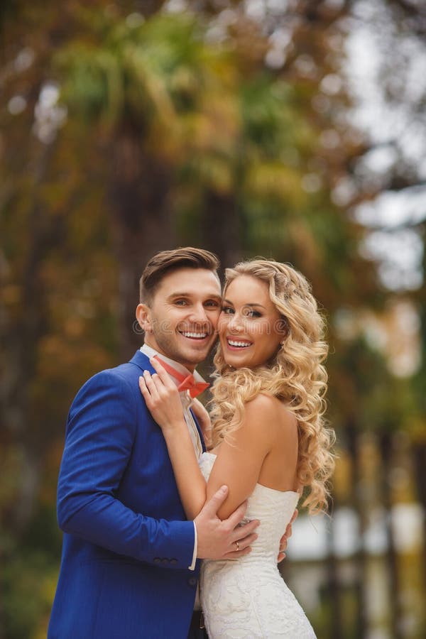 Autumn portrait of happy wedding couple.