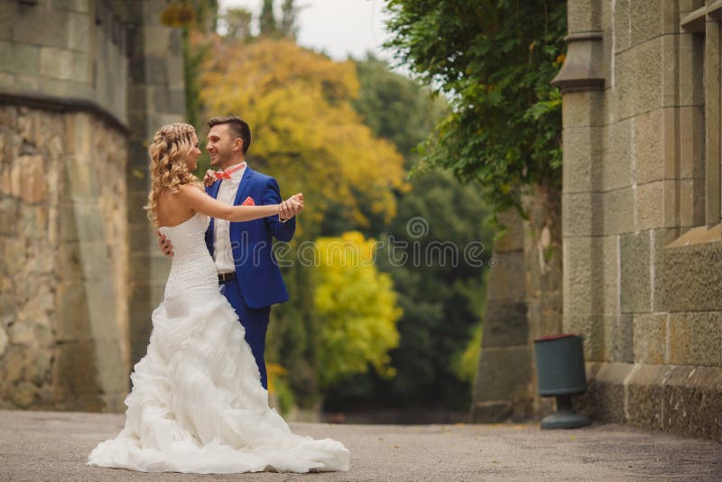 Autumn portrait of happy wedding couple.