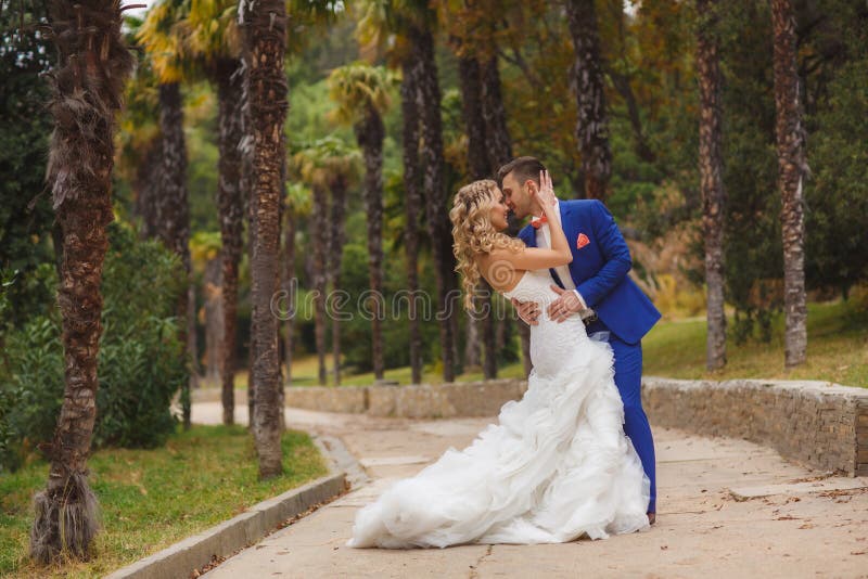 Autumn portrait of happy wedding couple.