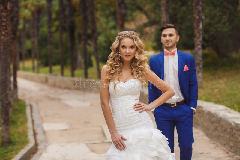 Autumn portrait of happy wedding couple.