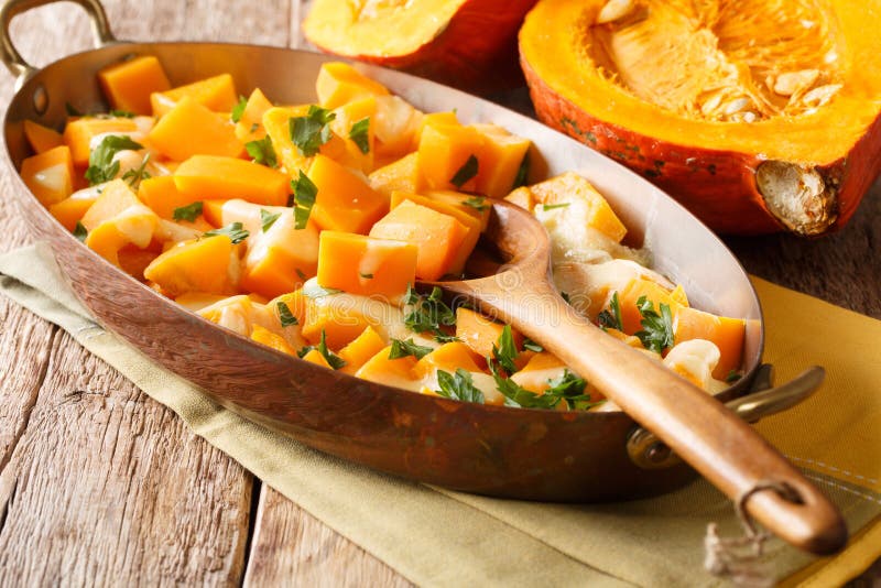 Autumn Pumpkin Casserole with Mozzarella Cheese and Herbs Close-up in a ...