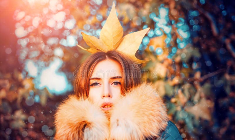 Autumn queen. Fall season outfit. Modern fashion outfit. Autumn season. Gorgeous pretty woman in furry coat fallen leaf stock photography Autumn queen. Fall season outfit. Modern fashion outfit. Autumn season. Gorgeous pretty woman in furry coat fallen leaf stock photography