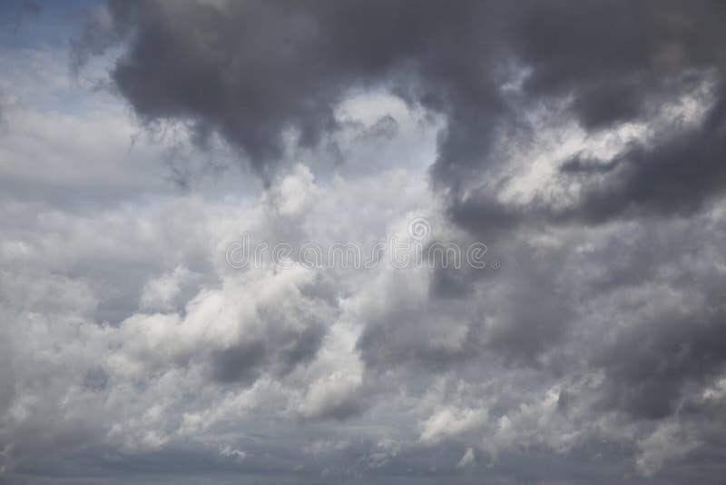 Autumn sky with grey heavy clouds stock photos