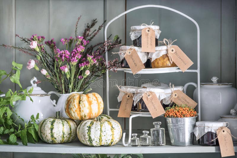 Autumn still life. Pumpkins, mint, dry flowers, heather, cloves, jars with waiting and old dishes stock images Autumn still life. Pumpkins, mint, dry flowers, heather, cloves, jars with waiting and old dishes stock images