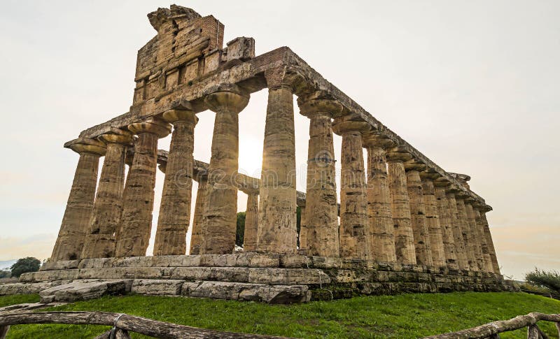 Autumn sunset at Paestum - UNESCO World Heritage Site, with some of the most well-preserved ancient Greek temples in the world, Italy. It's about three temples: Temple of Hera, Poseidon and Ceres. Autumn sunset at Paestum - UNESCO World Heritage Site, with some of the most well-preserved ancient Greek temples in the world, Italy. It's about three temples: Temple of Hera, Poseidon and Ceres.