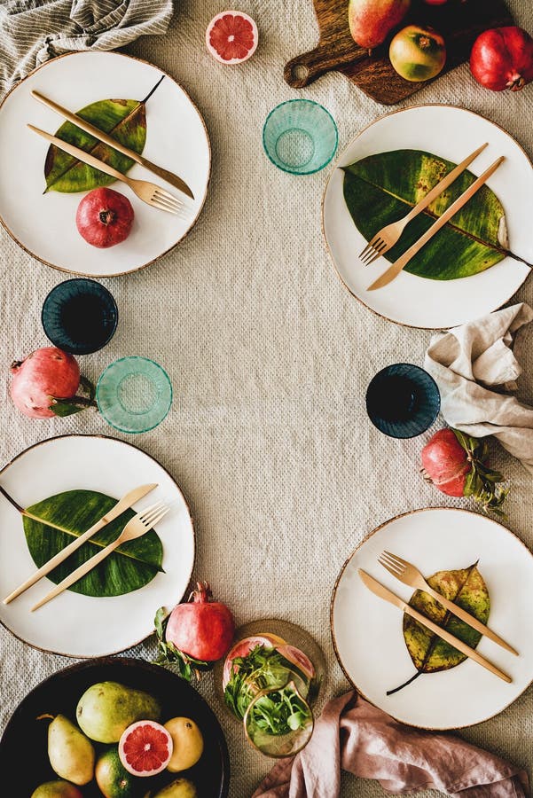 Autumn table setting with seasonal fruits and fallen leaves royalty free stock images Autumn table setting with seasonal fruits and fallen leaves royalty free stock images