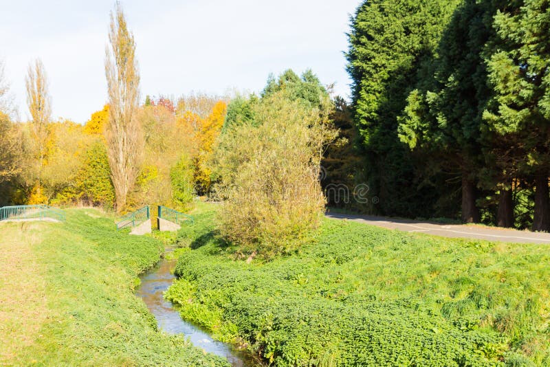 Autumn time in a local park with a stream running though stock photos Autumn time in a local park with a stream running though stock photos
