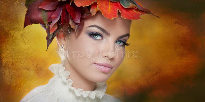 Autumn Woman. Beautiful creative makeup and hair style in outdoor shoot. Beauty Fashion Model Girl with Autumnal Make up and Hair