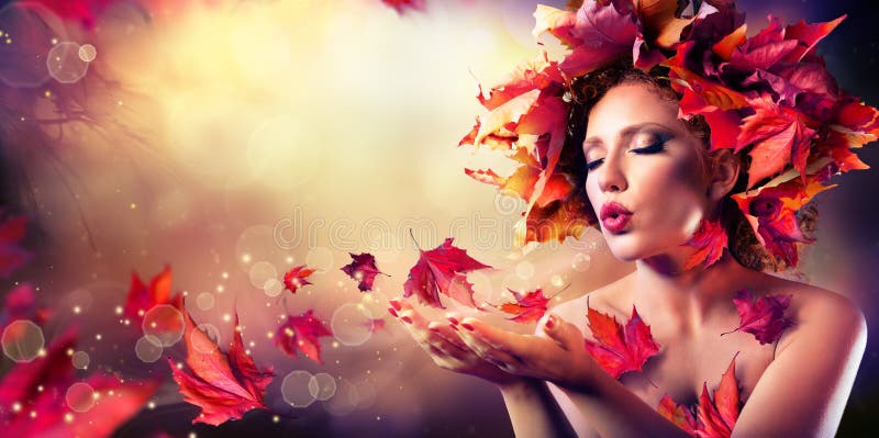 Autumn woman blowing red leaves stock image Autumn woman blowing red leaves stock image