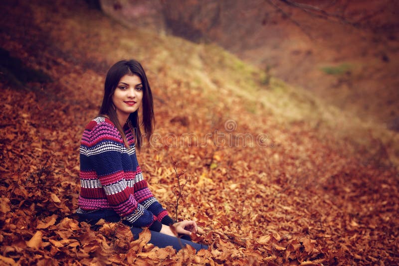 Autumn woman lying over leaves and smiling stock photos Autumn woman lying over leaves and smiling stock photos