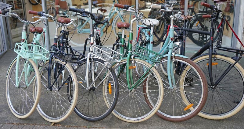 Sydney, Australia - October 17, 2017: Vintage Lekker bicycles parked nicely in a row outside bike shop. LEKKER brand is a leader in premium vintage bike designs, combining European design with retro style. Sydney, Australia - October 17, 2017: Vintage Lekker bicycles parked nicely in a row outside bike shop. LEKKER brand is a leader in premium vintage bike designs, combining European design with retro style.