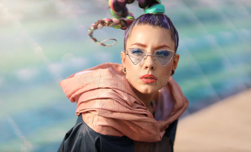 The avant-garde portrait girl with unusual make up and fancy sun glass. Avangarde fashion royalty free stock photo The avant-garde portrait girl with unusual make up and fancy sun glass. Avangarde fashion royalty free stock photo