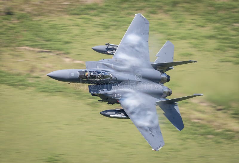 United States Air Force F15 / F15E fighter jet aircraft making a low level high G pass in the Mach Loop, Wales.nn. United States Air Force F15 / F15E fighter jet aircraft making a low level high G pass in the Mach Loop, Wales.nn