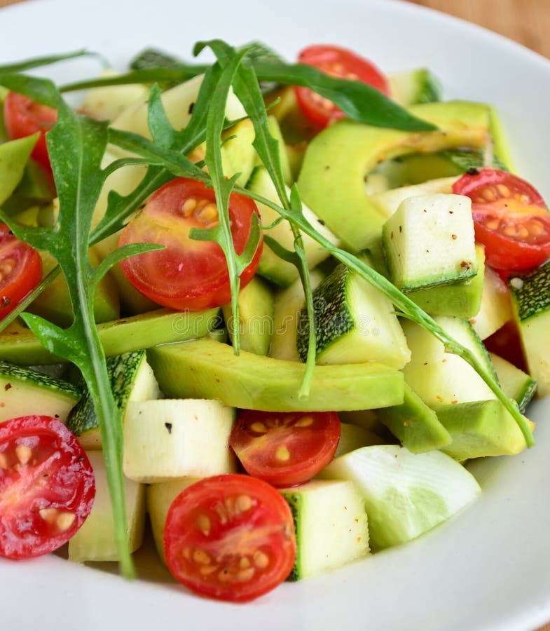 Avocado cherry tomato argula leave salad