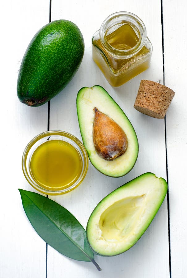 Avocado en avocadoolie stock afbeeldingen Avocado en avocadoolie stock afbeeldingen