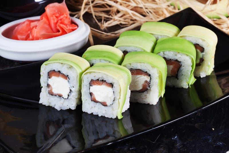 Avocado Roll and Salmon, Tuna in a Still Life Stock Photo Image of