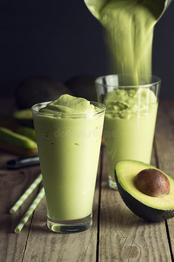 Avocado Shake or Smoothie Being Poured into Glasses Stock Photo - Image ...