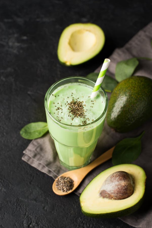 Avocado and Spinach Smoothie in Glass with Chia Seeds Stock Photo