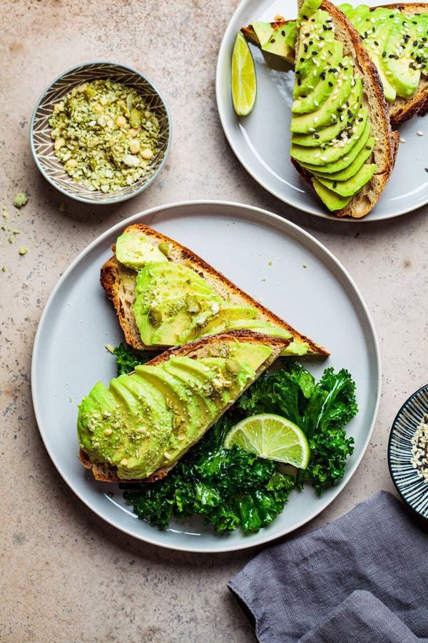 Avocado Toasts with Seeds on a Gray Plate, Top View. Plant Based Diet