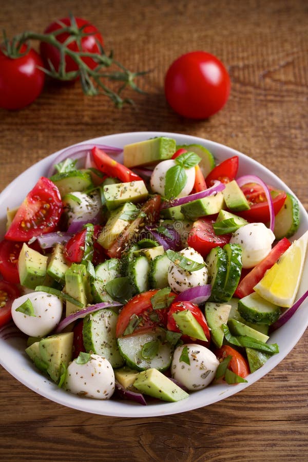 Avocado, Tomato, Cucumber Salad With Mozzarella Cheese In ...