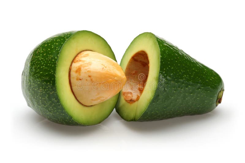 Avocat de vert de deux moitiés avec la graine d'isolement photo libre de droits Avocat de vert de deux moitiés avec la graine d'isolement photo libre de droits