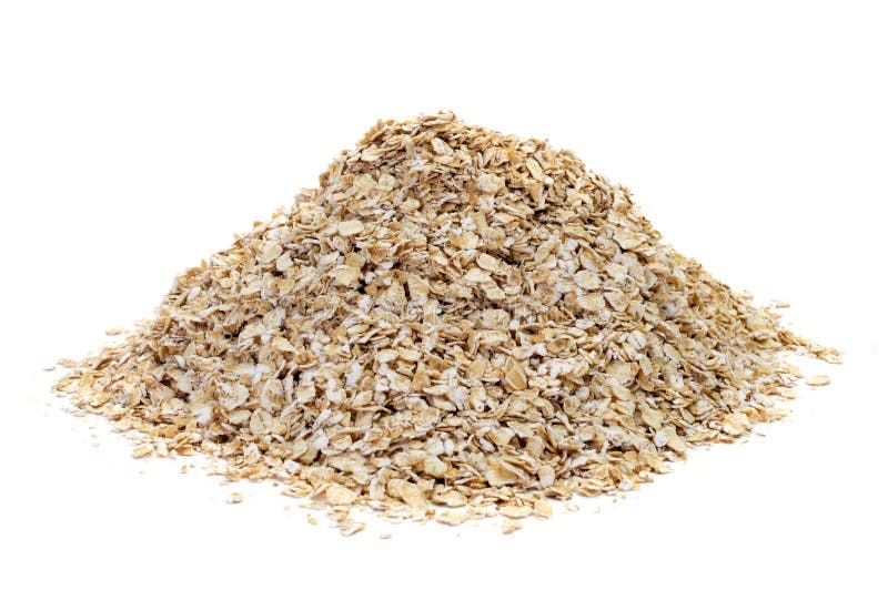 A pile of rolled oats on a white background. A pile of rolled oats on a white background