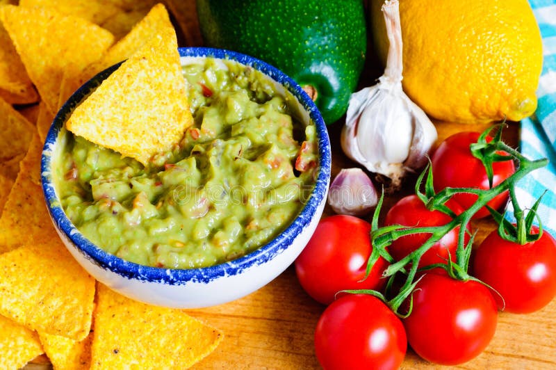 Ingredients for avocado guacamole with tortilla chips. Ingredients for avocado guacamole with tortilla chips