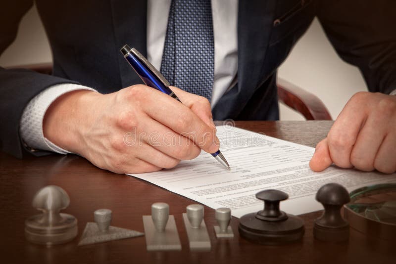 Lawyer, notary signs the documents from our office. Lawyer, notary signs the documents from our office