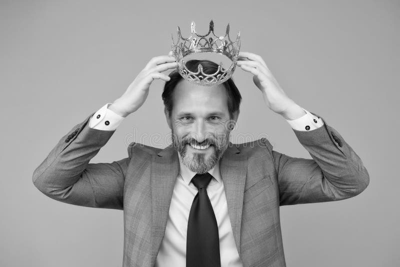 Award winner handsome man actor artist scientist with crown, fame and status concept royalty free stock image