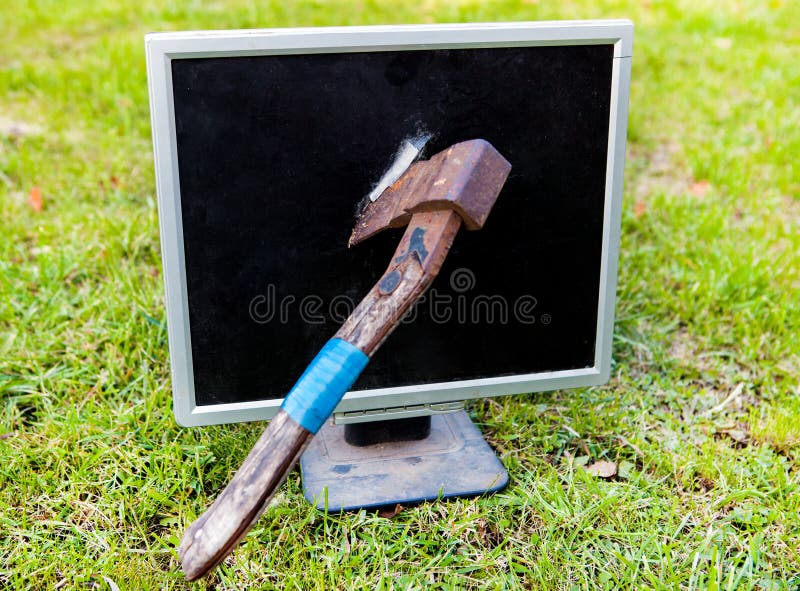 Axe in the Computer Monitor stock photos