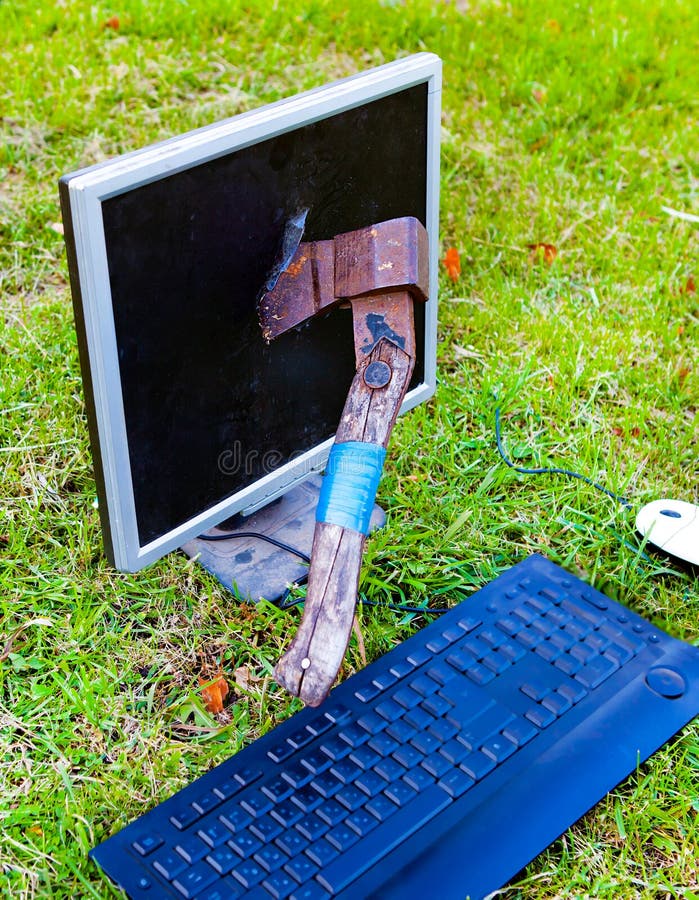 Axe in the Computer Monitor royalty free stock image