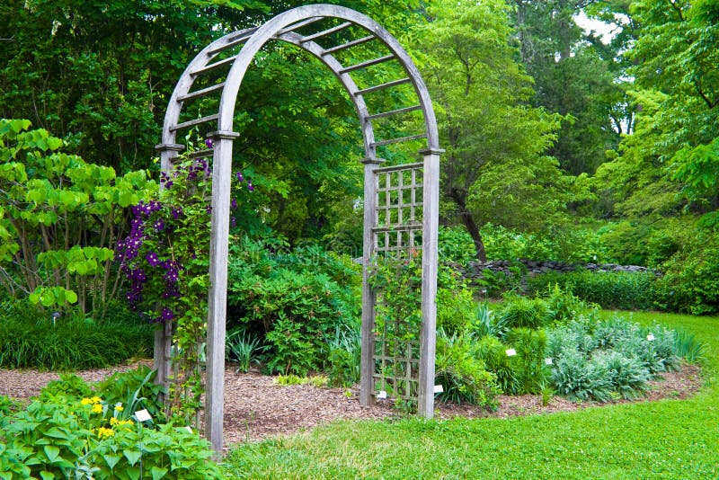 Wooden garden arbor with plants beginning to grow up and around it. Photographed at the state aboretum in Virginia. Wooden garden arbor with plants beginning to grow up and around it. Photographed at the state aboretum in Virginia.