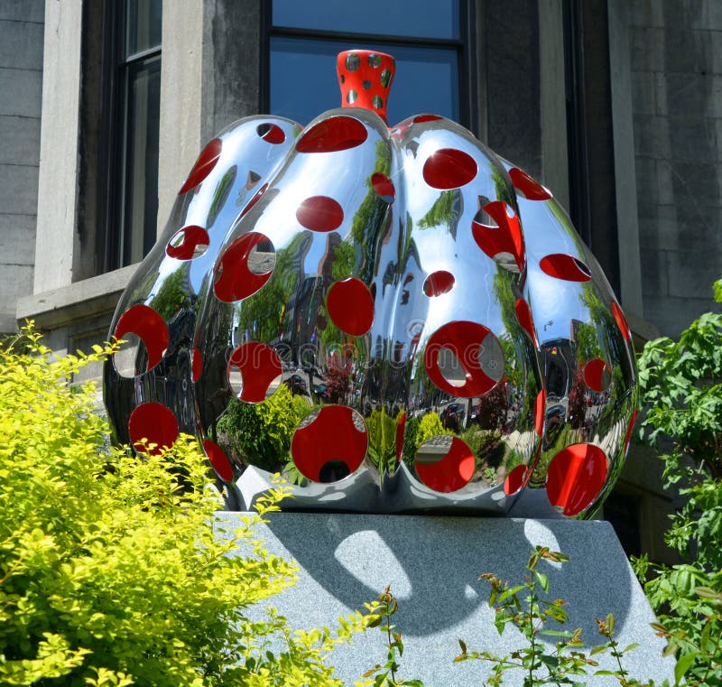 MONTREAL QUEBEC CANADA 06 12 17: Yayoi Kusama, PUMPKIN, polished stainless steel, urethane paint, developed a distinctive style utilizing approaches associated with Abstract Expressionism. MONTREAL QUEBEC CANADA 06 12 17: Yayoi Kusama, PUMPKIN, polished stainless steel, urethane paint, developed a distinctive style utilizing approaches associated with Abstract Expressionism