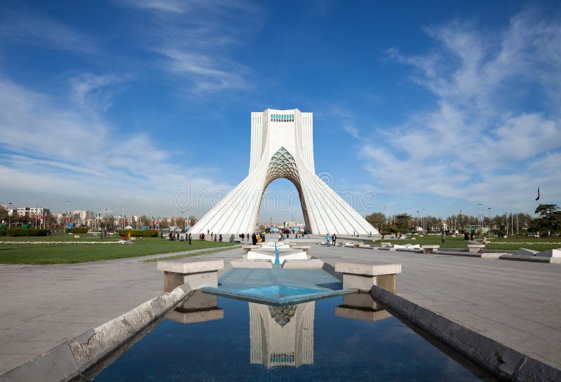 Azadi Monument and Its Reflection on Water Against Blue Sky in Tehran