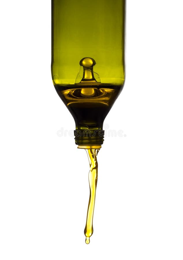 Olive oil pouring from green bottle, isolated against white background. Olive oil pouring from green bottle, isolated against white background.