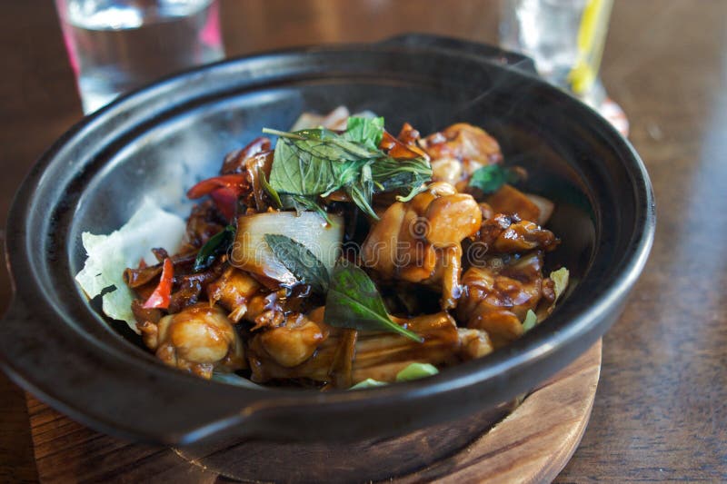 Authentic asian food in metal bowl on bamboo plate. Authentic asian food in metal bowl on bamboo plate