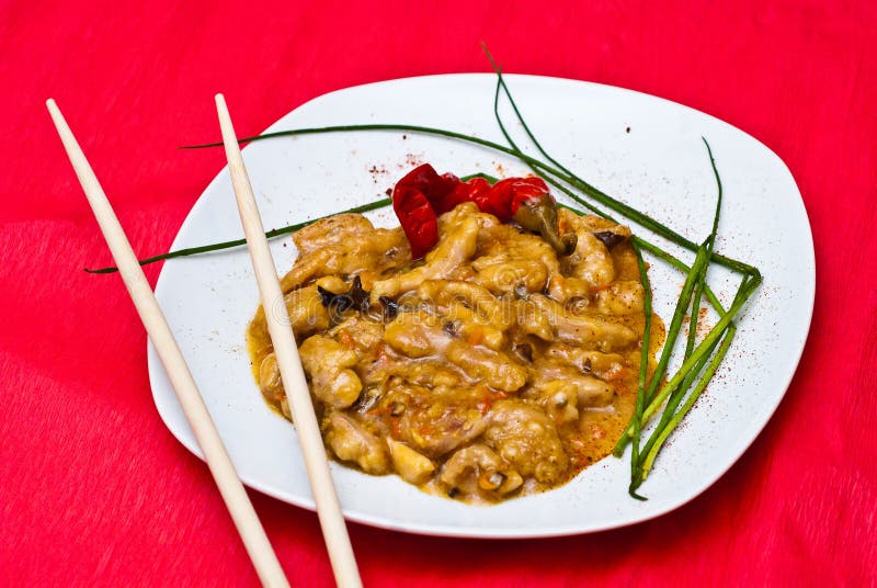 Dish of Asian food made from chicken with sweet and sour sauce. Dish of Asian food made from chicken with sweet and sour sauce.