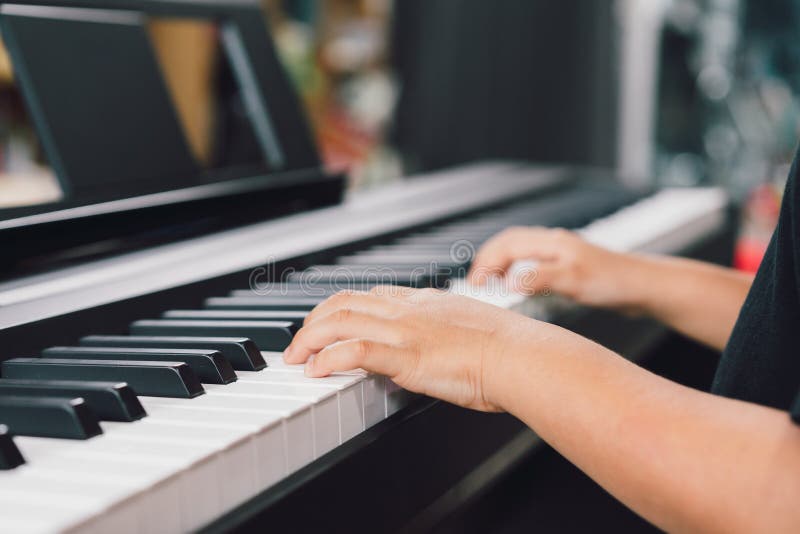 An asian boys playing the piano. An asian boys playing the piano.