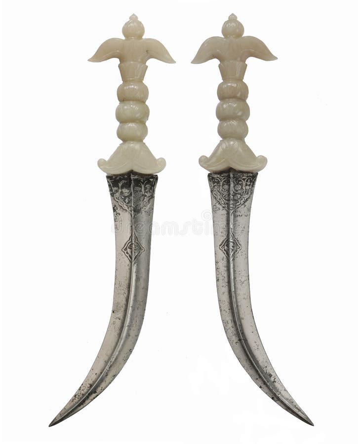 Rare and unusual Asian daggers with curved steel blade ivory handle gold decorated pins isolated on white. Rare and unusual Asian daggers with curved steel blade ivory handle gold decorated pins isolated on white