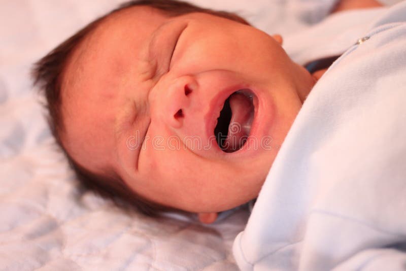 Asian baby crying on bed,concept of health and growth. Asian baby crying on bed,concept of health and growth.