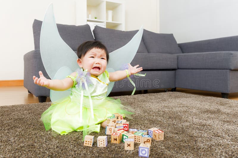 Asian baby girl crying with halloween party dressing at home. Asian baby girl crying with halloween party dressing at home