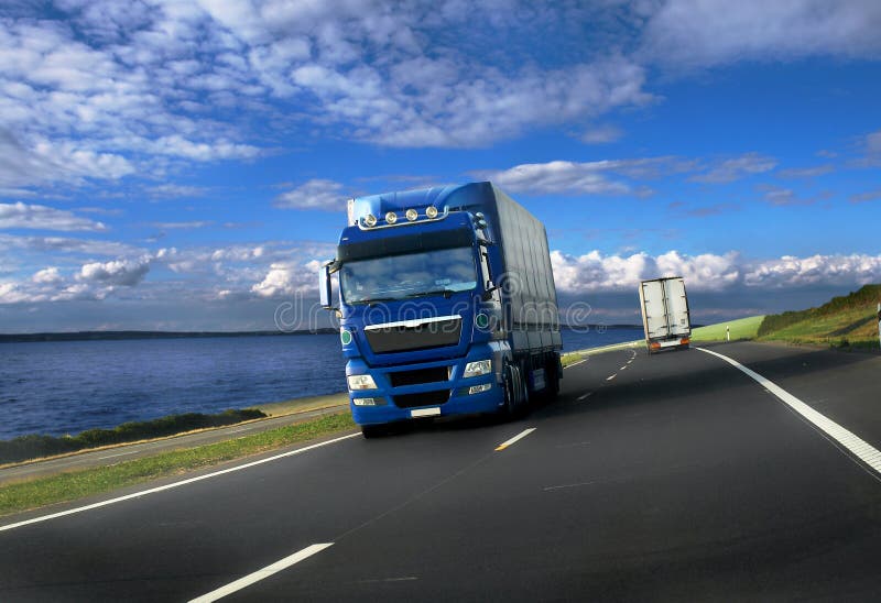 Blue truck on seaside background. Blue truck on seaside background