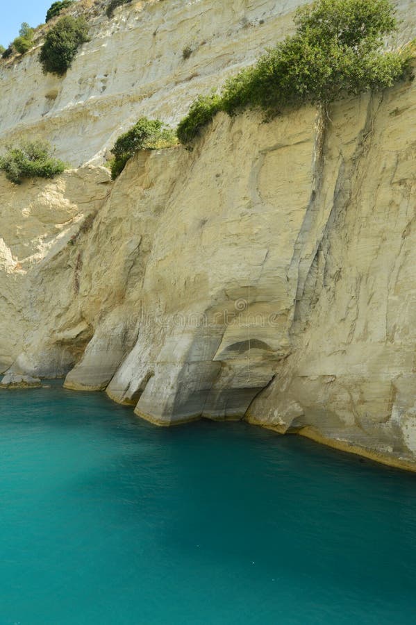 Nice Greenish Blue Tone Of The Sea United To The Molten Limestone Rock In Some Beautiful Rays Of Sun By Canal De Corinto. Architecture, Travel, Landscapes. July 8, 2018. Corinth Canal Peloponnese Greece. Nice Greenish Blue Tone Of The Sea United To The Molten Limestone Rock In Some Beautiful Rays Of Sun By Canal De Corinto. Architecture, Travel, Landscapes. July 8, 2018. Corinth Canal Peloponnese Greece.