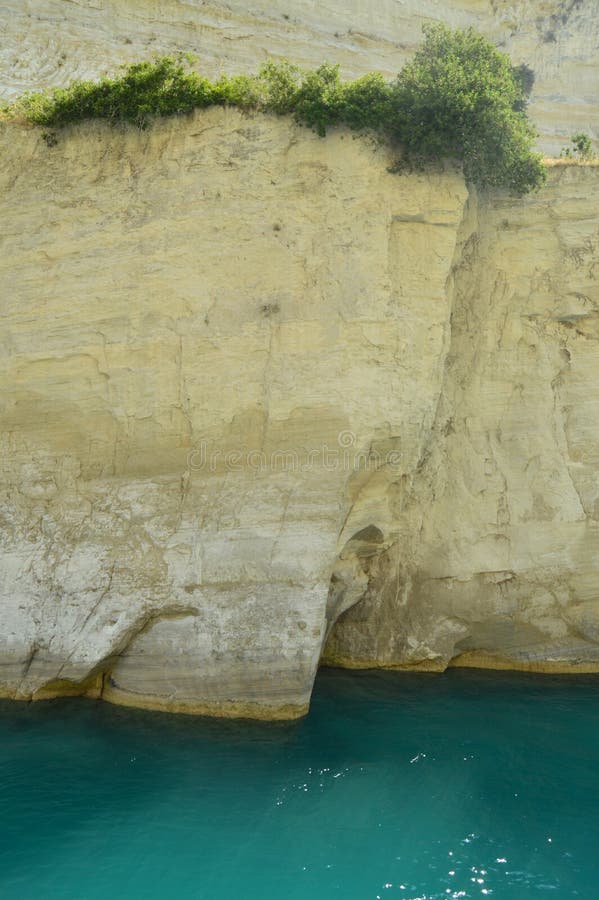 Nice Greenish Blue Tone Of The Sea United To The Molten Limestone Rock In Some Beautiful Rays Of Sun By Canal De Corinto. Architecture, Travel, Landscapes. July 8, 2018. Corinth Canal Peloponnese Greece. Nice Greenish Blue Tone Of The Sea United To The Molten Limestone Rock In Some Beautiful Rays Of Sun By Canal De Corinto. Architecture, Travel, Landscapes. July 8, 2018. Corinth Canal Peloponnese Greece.