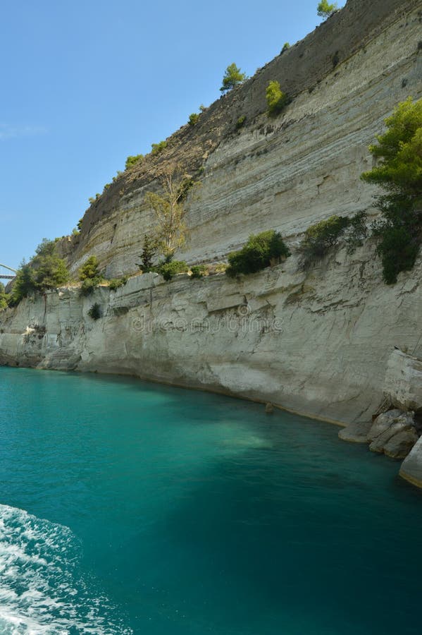 Nice Greenish Blue Tone Of The Sea United To The Molten Limestone Rock In Some Beautiful Rays Of Sun By Canal De Corinto. Architecture, Travel, Landscapes. July 8, 2018. Corinth Canal Peloponnese Greece. Nice Greenish Blue Tone Of The Sea United To The Molten Limestone Rock In Some Beautiful Rays Of Sun By Canal De Corinto. Architecture, Travel, Landscapes. July 8, 2018. Corinth Canal Peloponnese Greece.